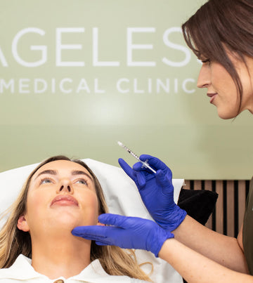 Woman receiving a facial injection at Angeles Medical Clinic.