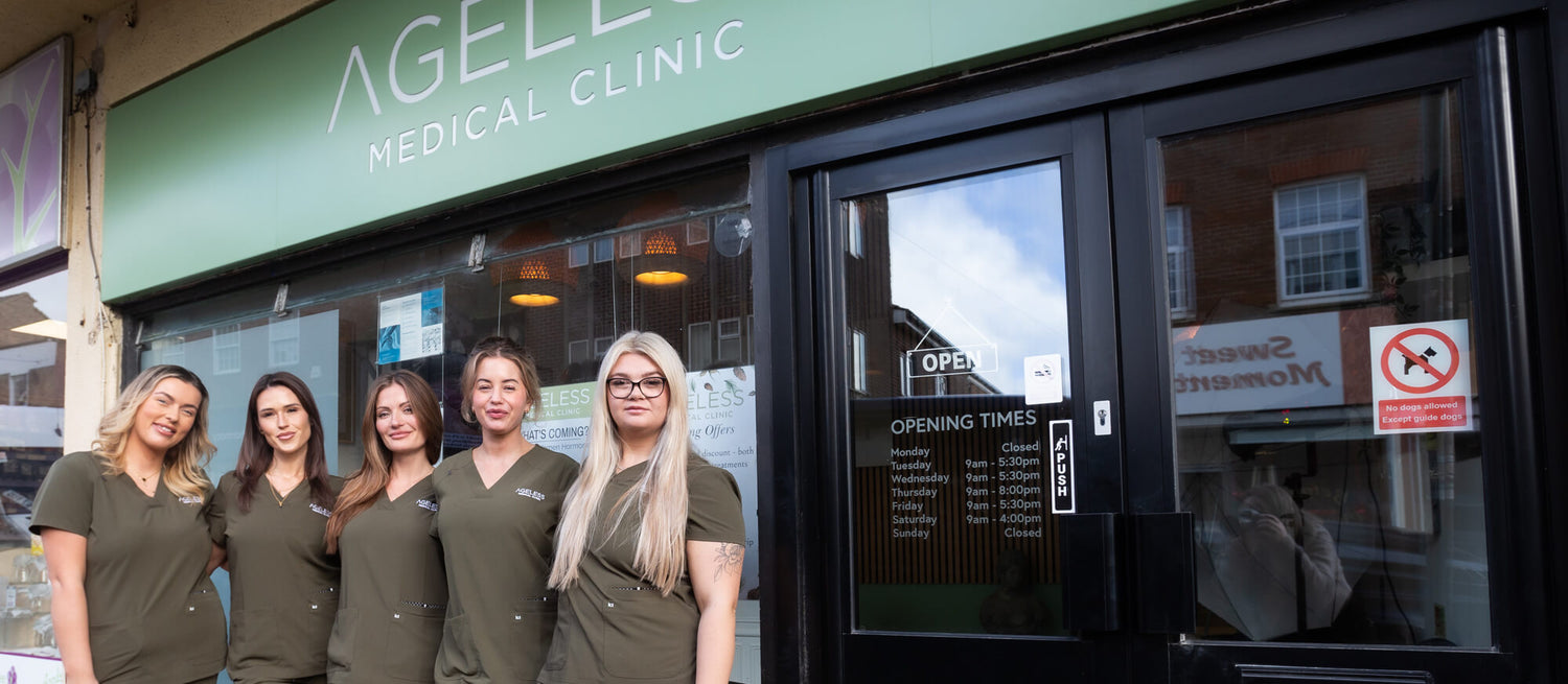 Group of women in green uniforms standing outside a medical clinic  - Ageless Medical Clinic
