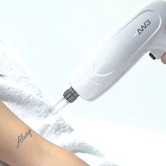 Person using a white handheld device on their arm with a blurred background